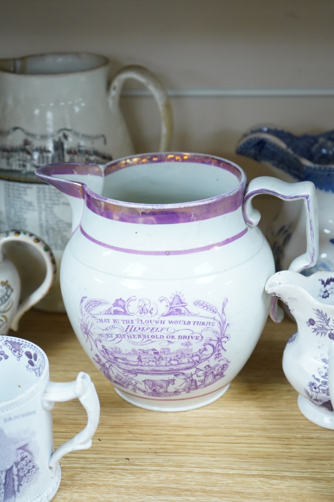 Eleven early to mid 19th century jugs, mugs and plates, all with transfer printed commemorative themes including Gladstone as Prime Minister, Queen Victoria‘s 1887 Jubilee, the Bidston Lighthouse Signals, Lord John Russe